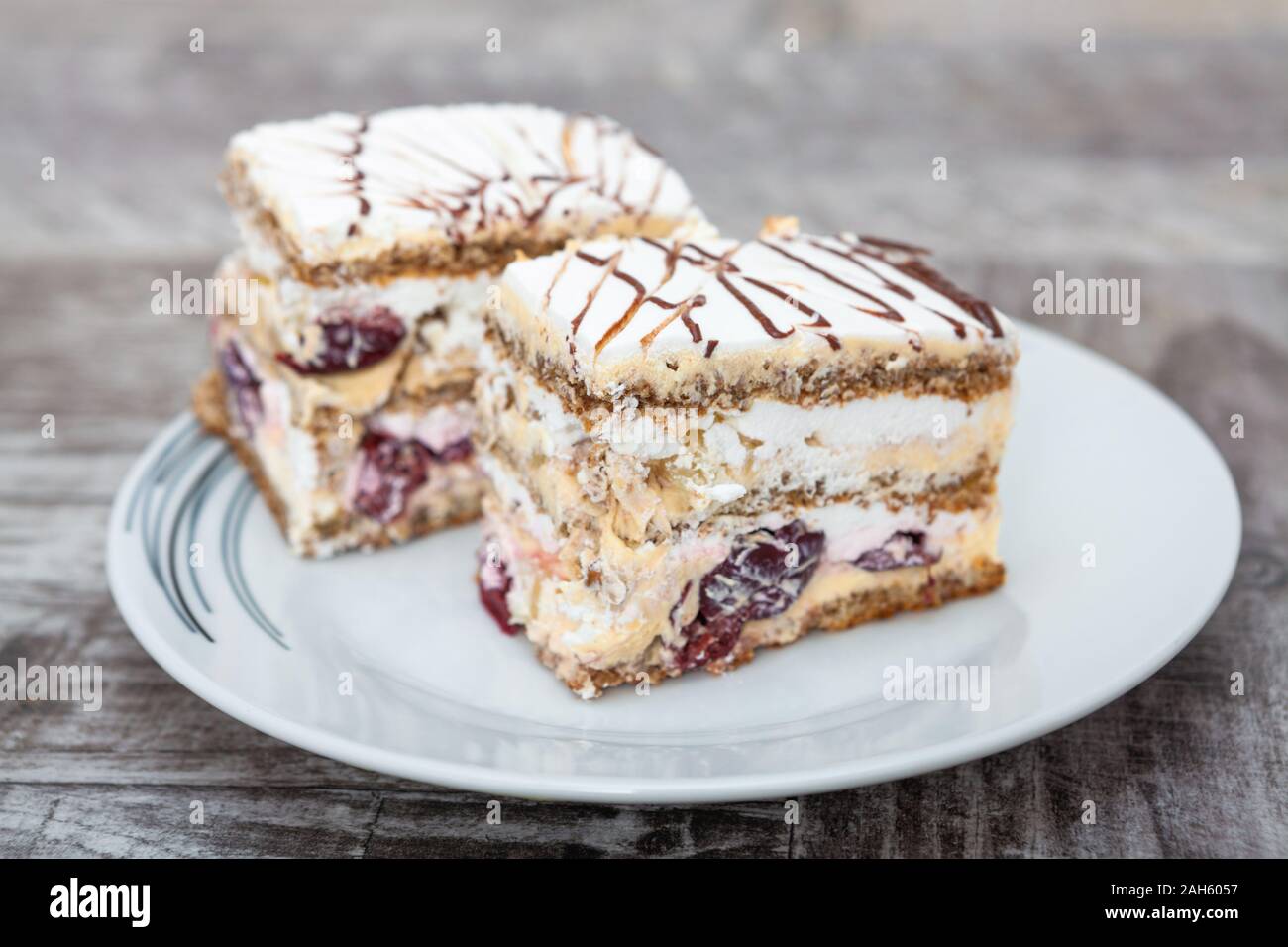 Walnut, cherry and vanilla cream cake Stock Photo