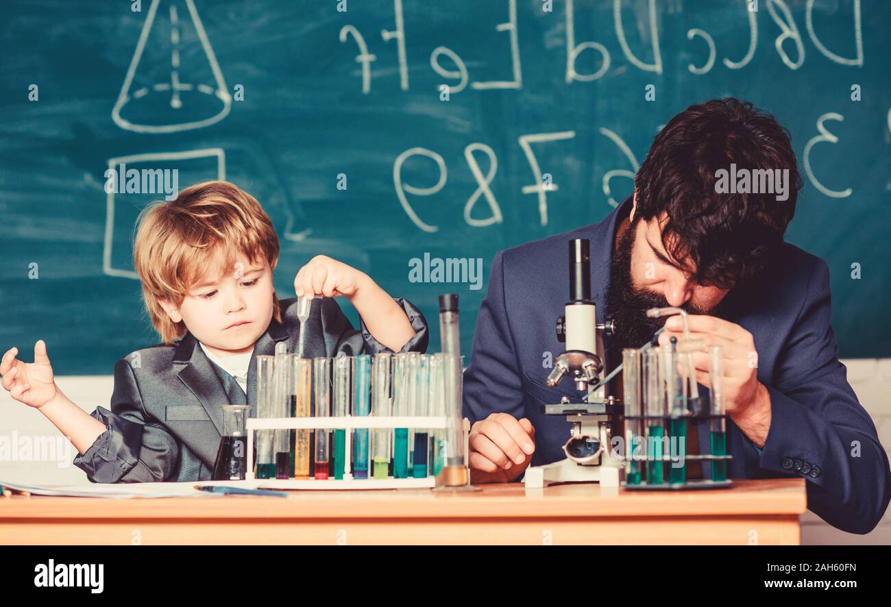Touching Lives Forever. father and son at school. teacher man with ...