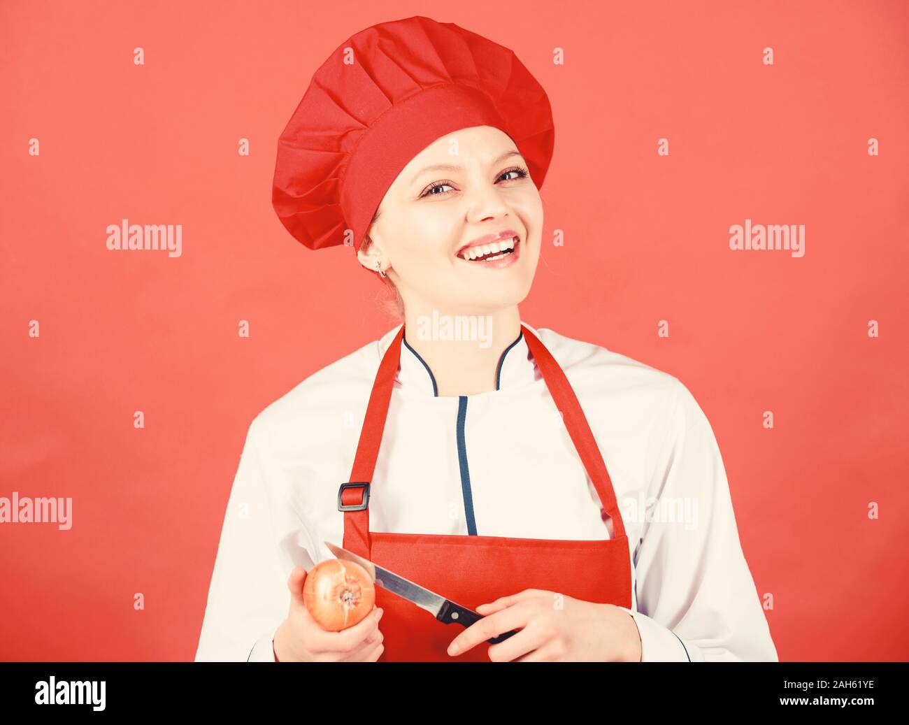 Girl cooking healthy meal. Slice and chop onion. Suffer but keep doing. Stinging eyes and tears