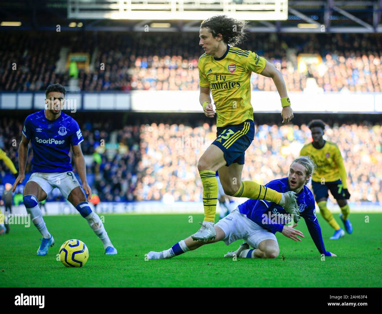 21st December 2019, Goodison Park, Liverpool, England; Premier League, Everton v Arsenal : David Luiz (23) of Arsenal rides a challenge from Tom Davies (26) of EvertonCredit: Conor Molloy/News Images Stock Photo