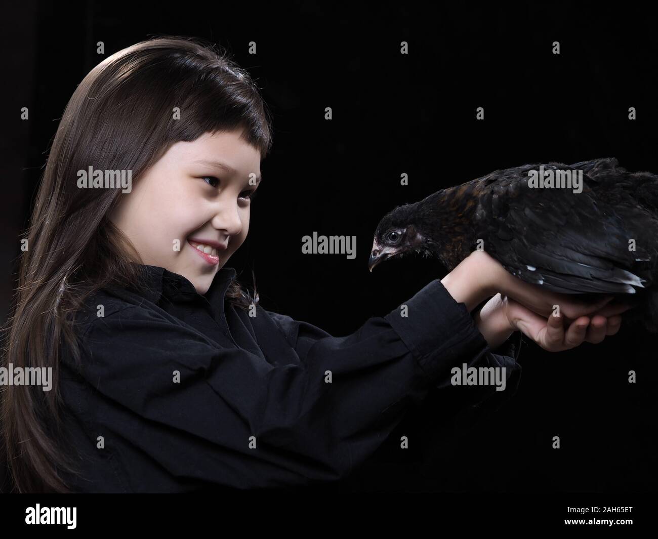 Emotional portrait of a child with a bird Stock Photo - Alamy