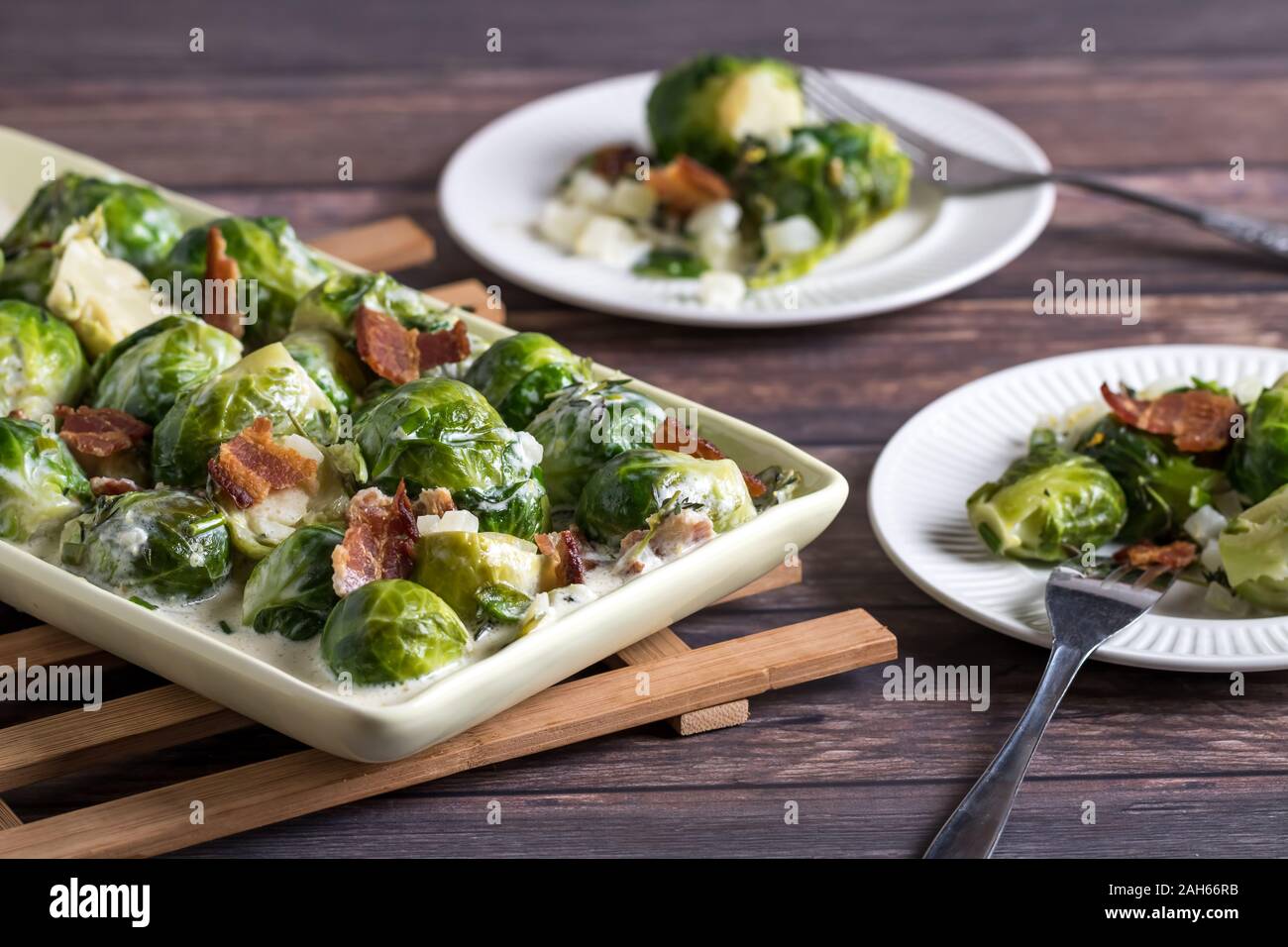 Cooked brussel sprouts with bacon. Stock Photo