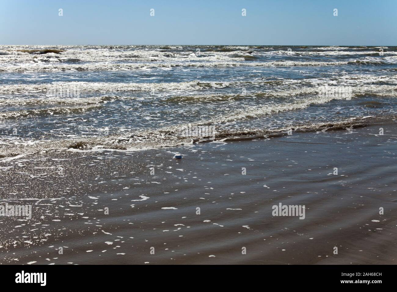 Seemingly endless waves roll on to Galveston's West Beach on the Gulf of Mexico, Texas coast. Stock Photo