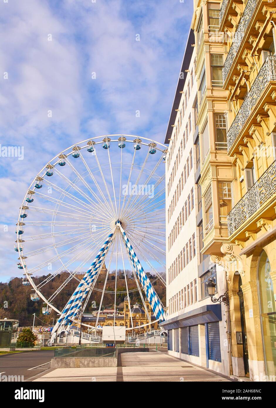 A Ferris wheel in the city of San Sebastian. View from Miramar street. Basque Country, Spain. Stock Photo