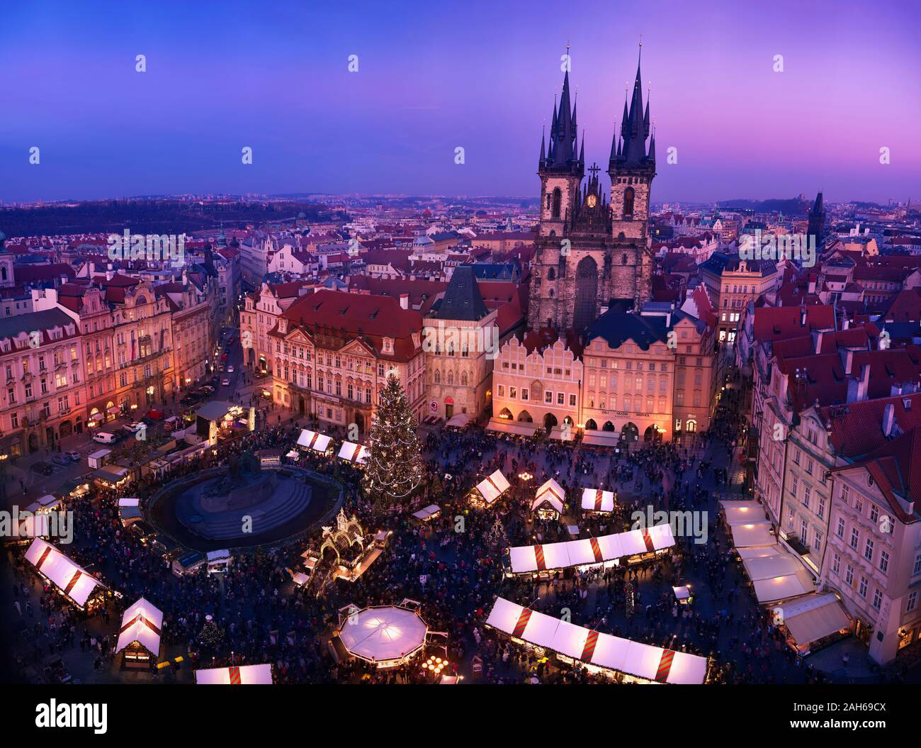 PRAGUE, THE CZECH REPUBLIC - DECEMBER 20, 2019: People enjoying Chistmas atmosphere at Christmas market on old town square after sunset. Stock Photo