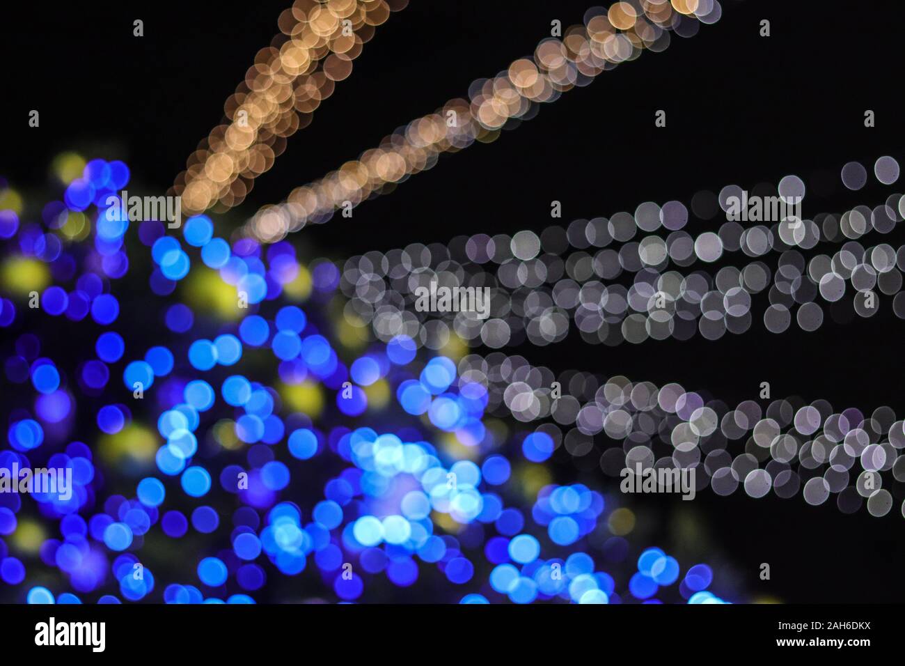 Abstract christmas tree bokeh lights of classic blue and white color blur background. Stock Photo
