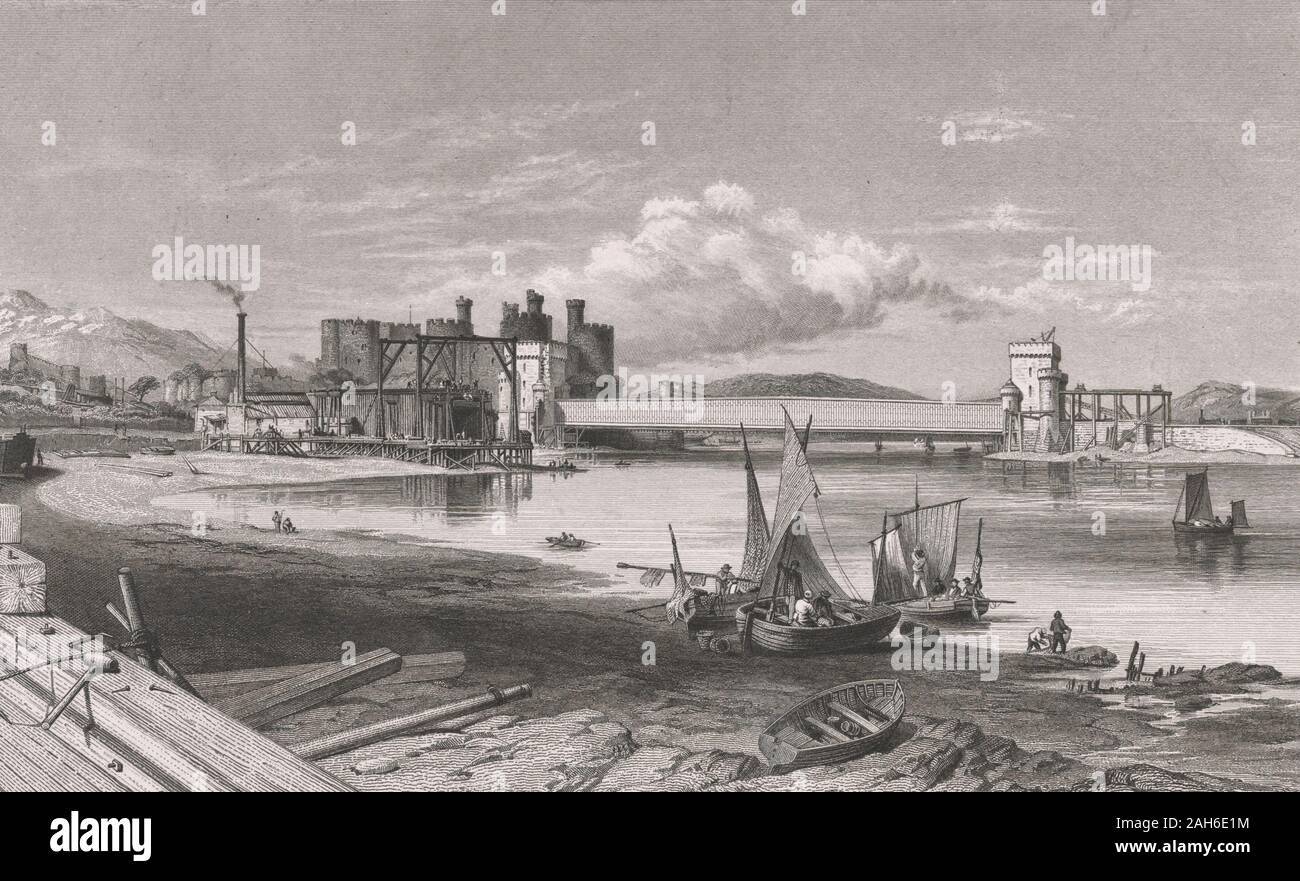 Conway [i.e., Conwy] Bridge, North Wales -  Print shows the River Conwy in North Wales with boats on shore in the foreground and the Conwy Castle with a railroad bridge, designed by Robert Stephenson, extending across the river in the background. Also shows scaffolding, possibly for ship building or some other facility. 1848 Stock Photo