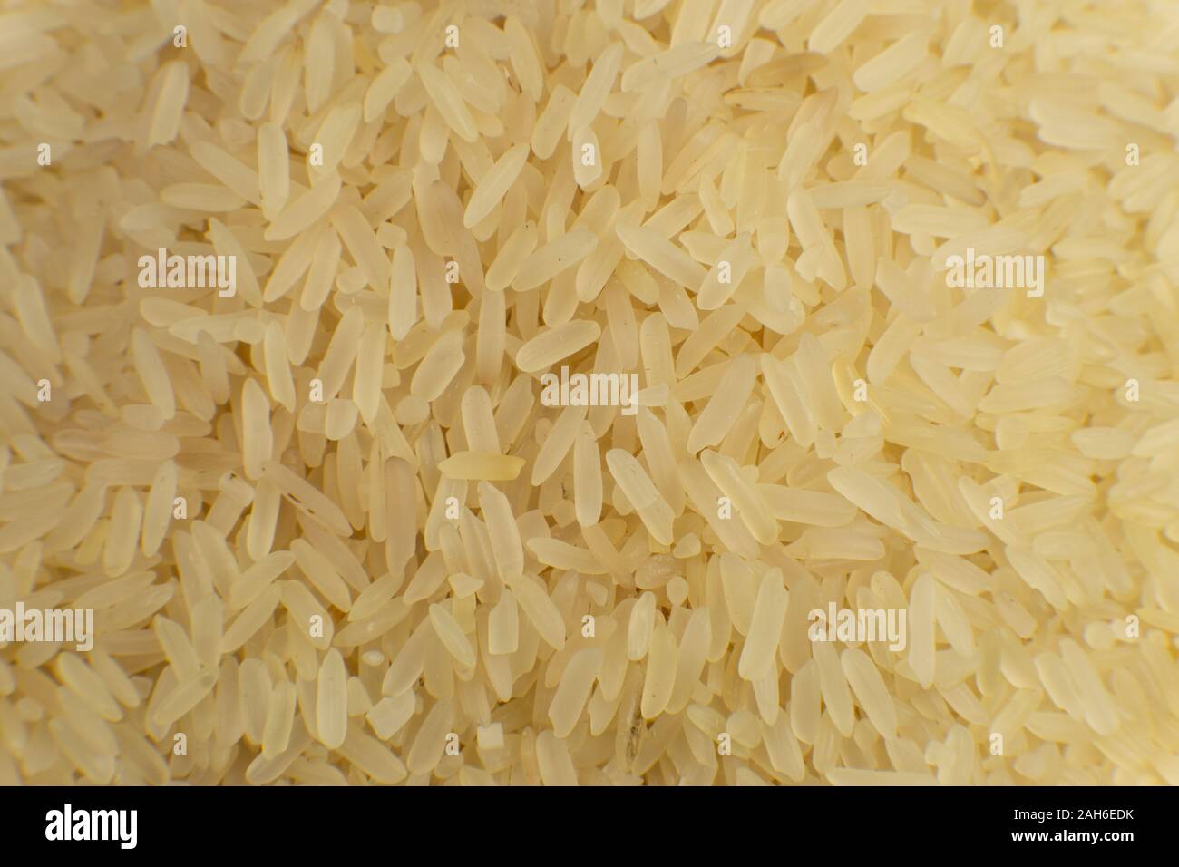 Long grain white rice background. Macro, closeup. Rice texture. Top view. Stock Photo