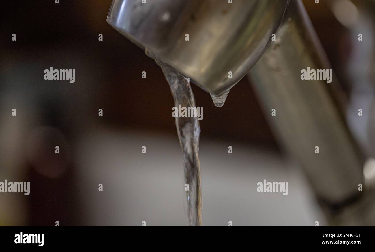 Water dripping slowly from faucet Stock Photo Alamy