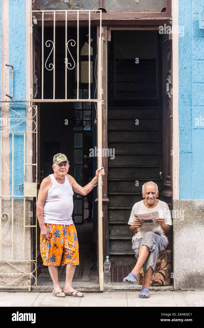 People of Havana Series - Two neighbors, outside of their homes talking. Stock Photo