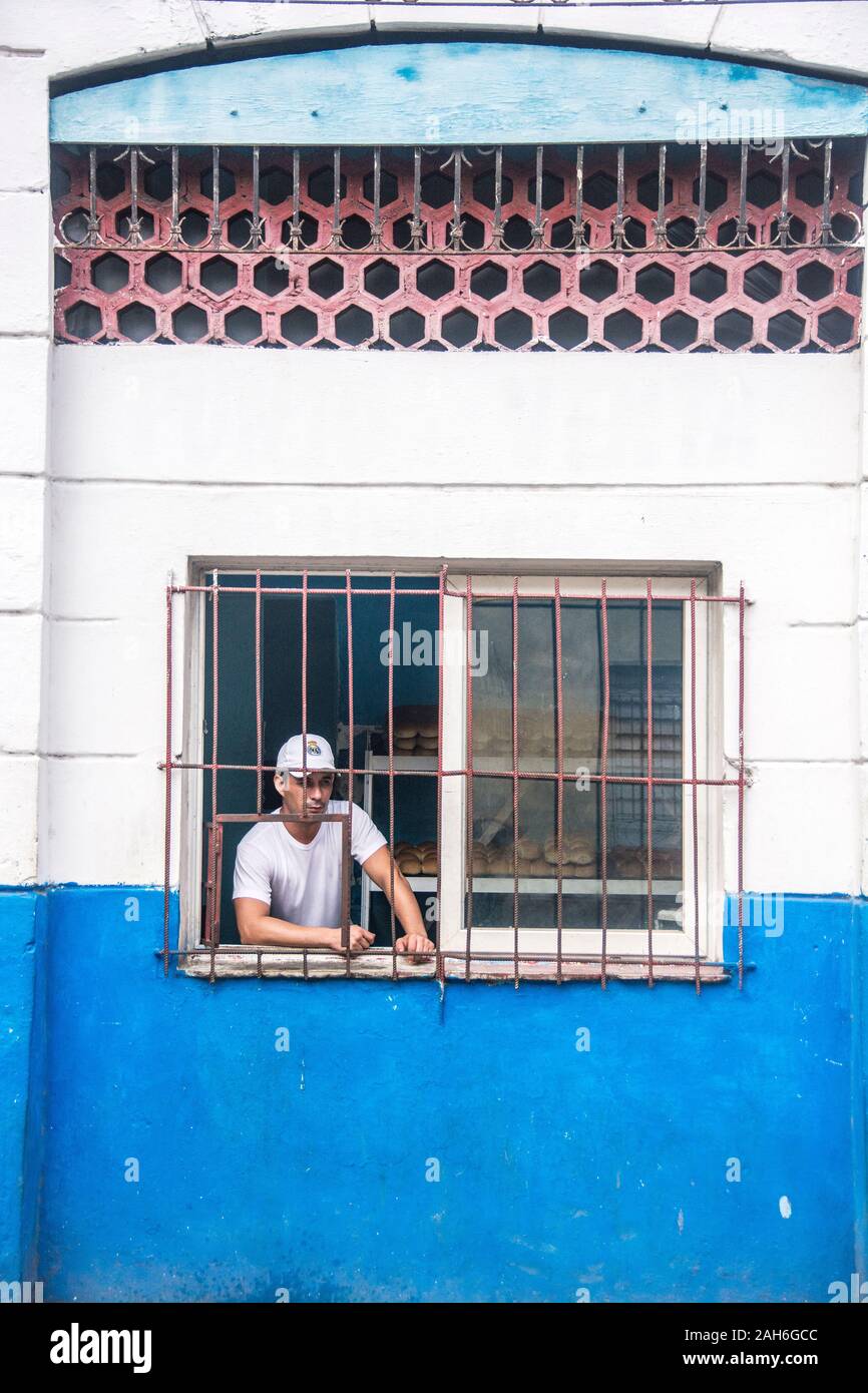 People of Havana Series - A Cuban baker looking out the window of his bakery. Stock Photo
