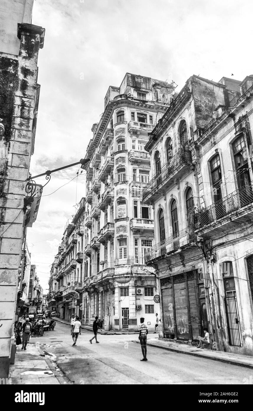 People of Havana Series - Old buildings and children playing in the street. Stock Photo