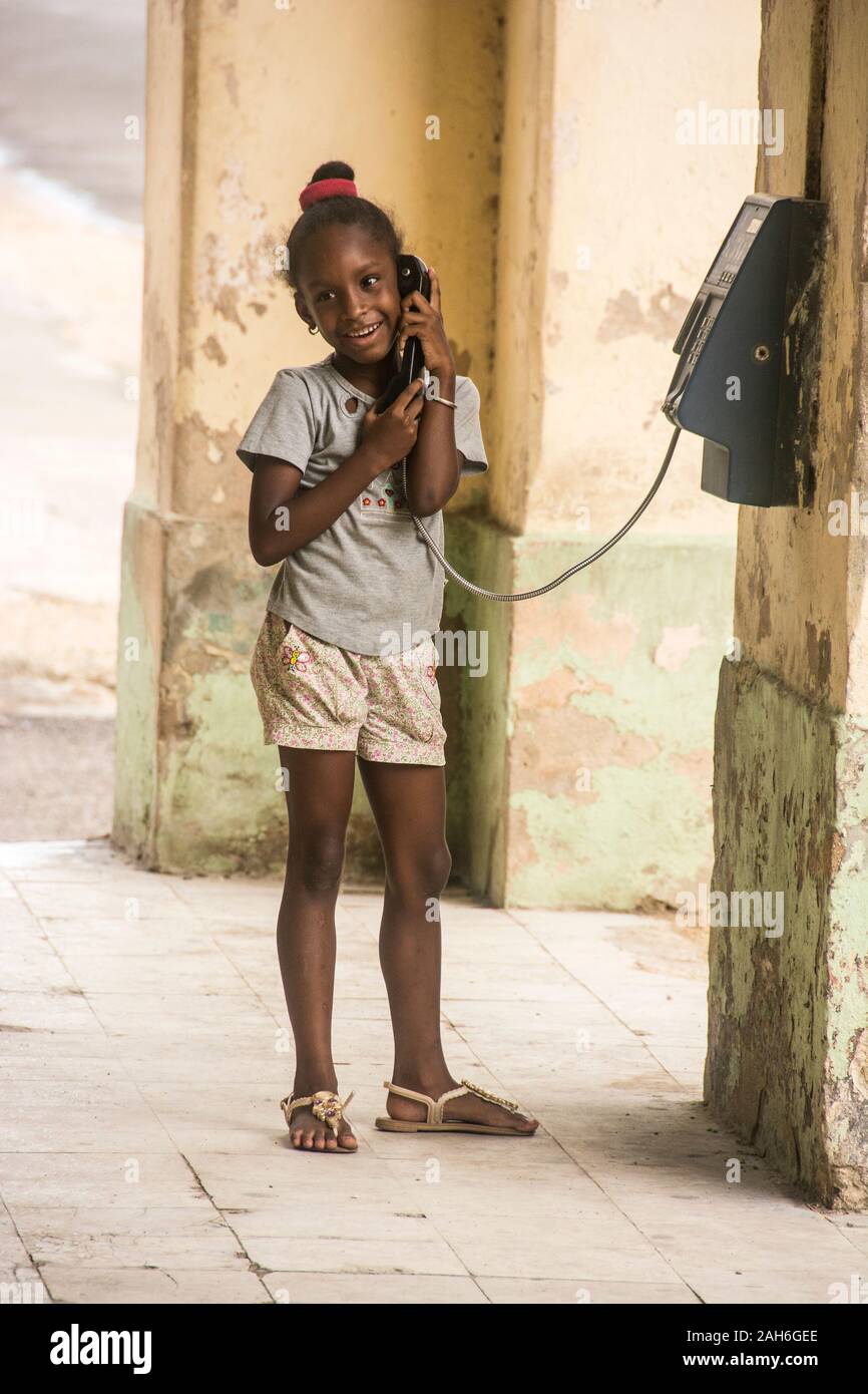 People of Havana Series - A little, Cuban girl talking on the phone Stock Photo