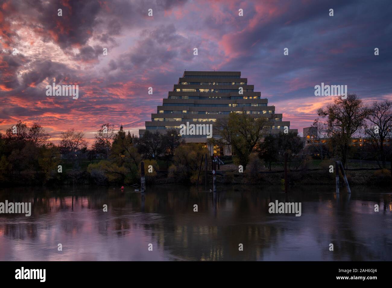 Sacramento, CA, Dec 12, 2019. The Ziggurat Building at the Riverfront Park in West Sacramento, Califoria, U.S.A., in the sunset, viewed from Old Sacra Stock Photo