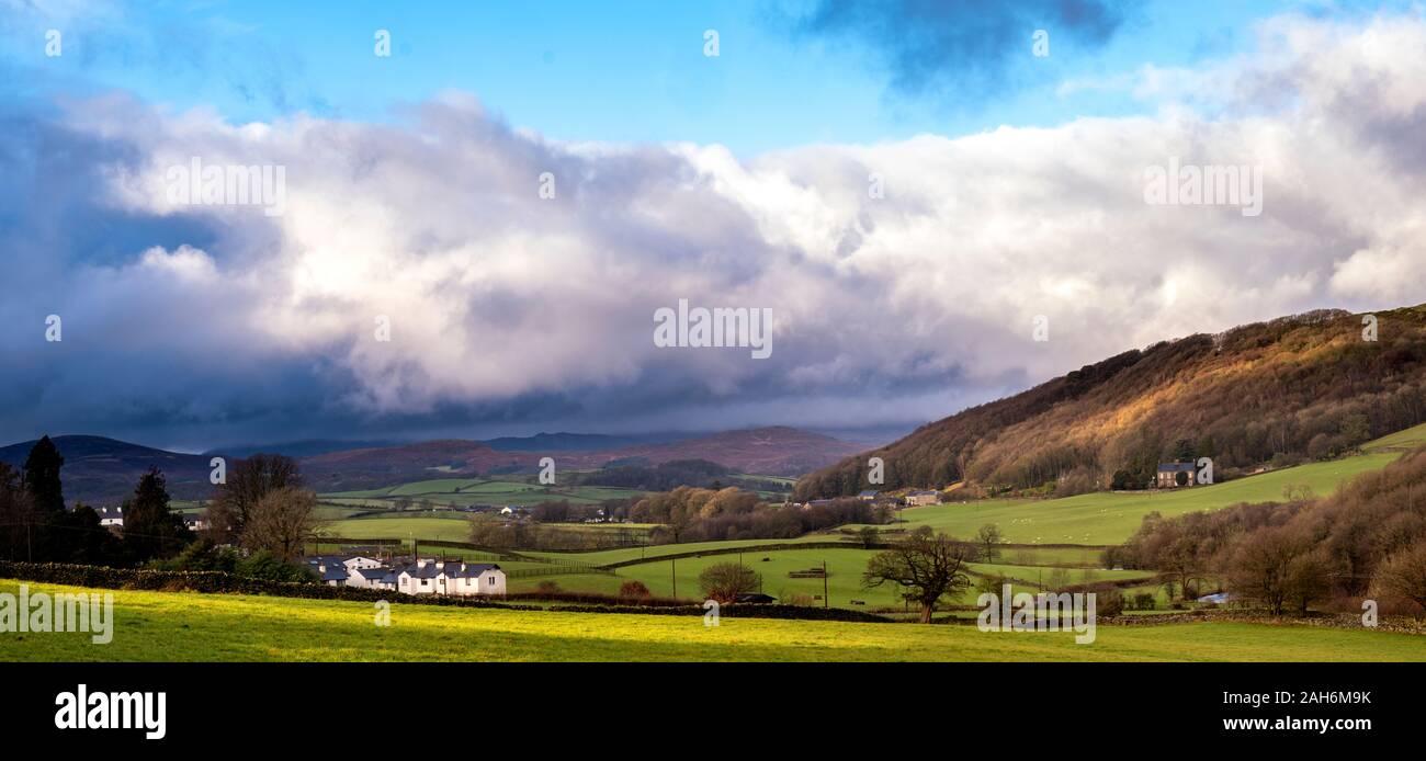 Looking up the Crake Valley across Lowick and on towards the Furness Fells hidden by low cloud. Stock Photo