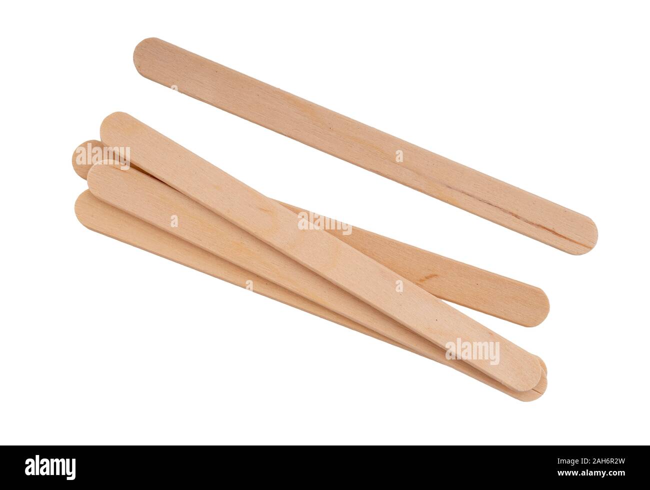 Wooden lollipop, popsicle or craft sticks, isolated on white background. Stock Photo