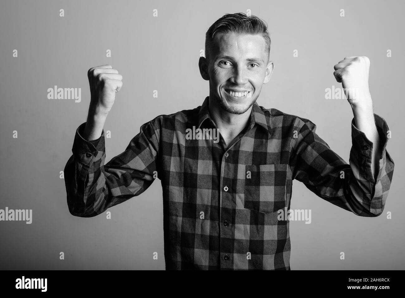 Portrait of excited young man hi-res stock photography and images - Alamy
