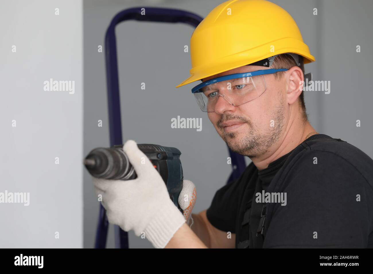Man in protective helmet and eyewear Stock Photo