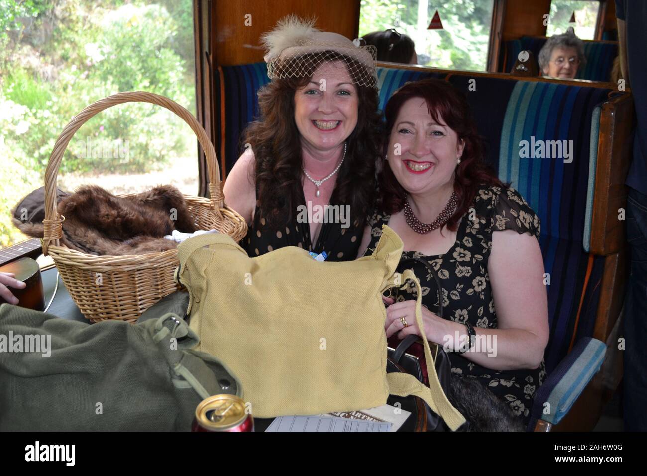 Two ladies enjoying a 1940s event on the Severn Valley Railway. 1940s weekend, Shropshire, UK Stock Photo