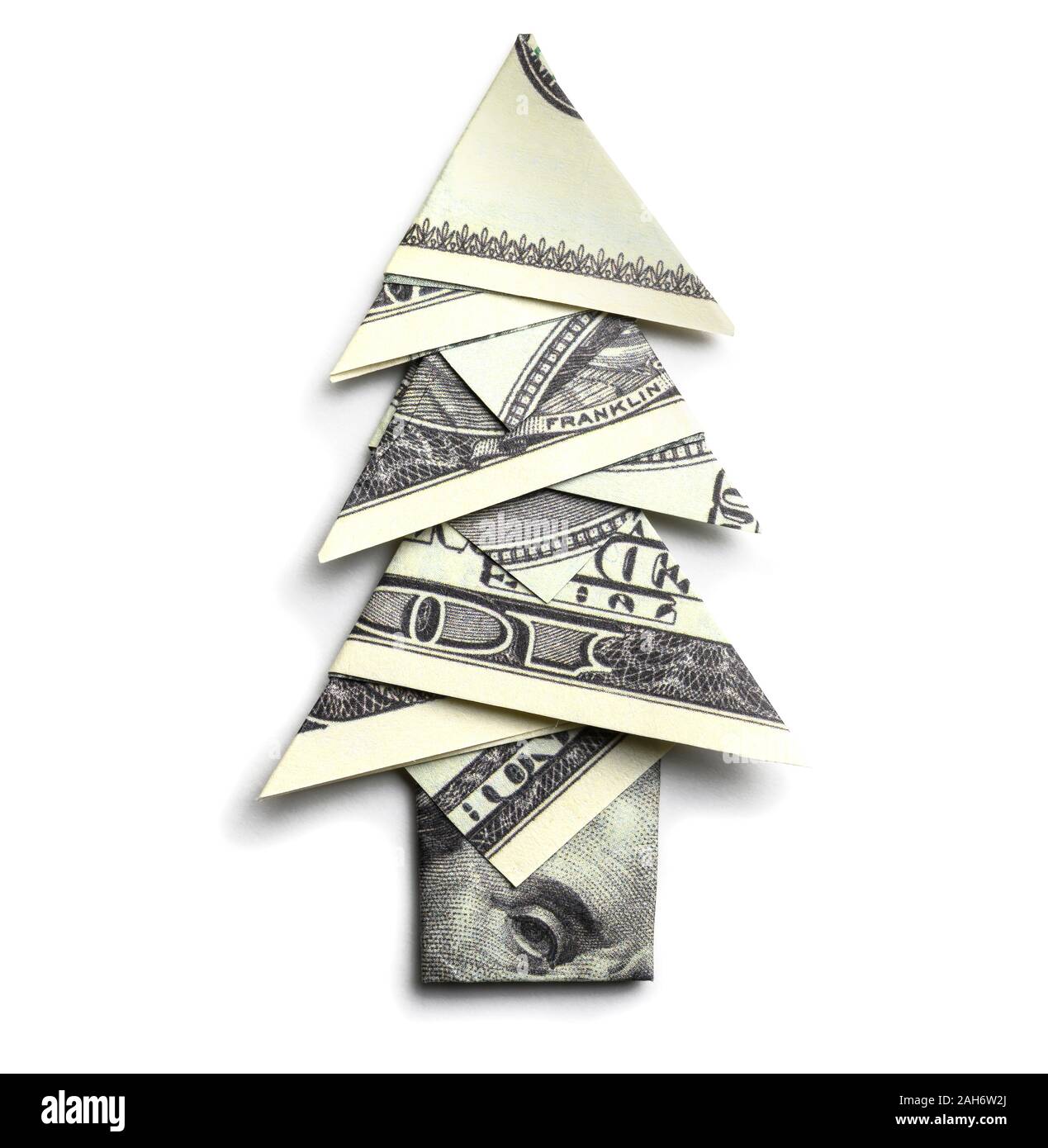 100 us dollars in the shape of a Christmas tree on a white background Stock Photo