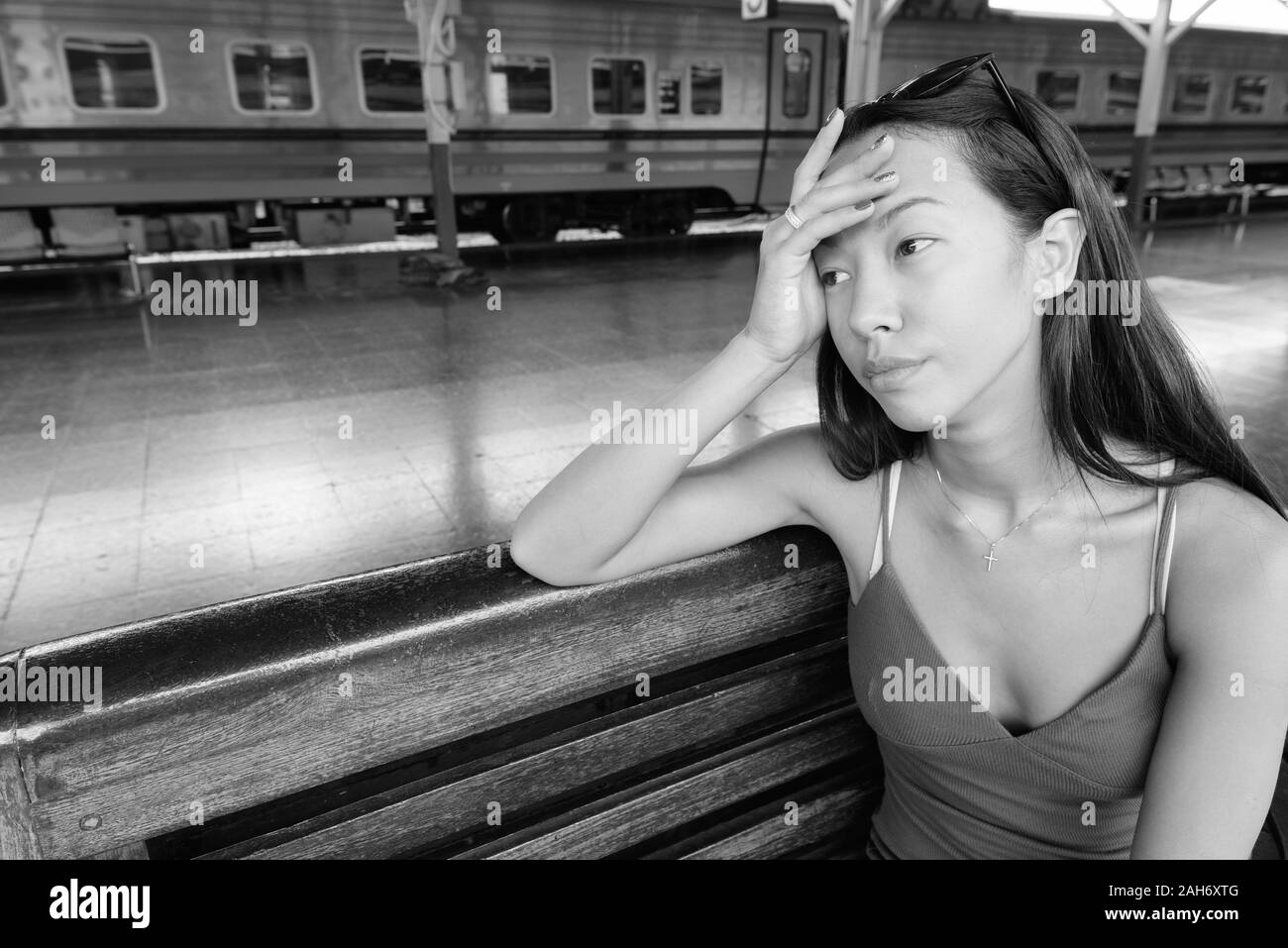 Young beautiful tourist woman exploring the city of Bangkok Stock Photo