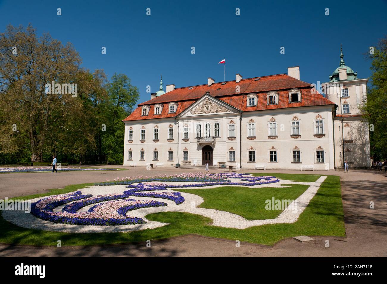 Radziwiłł's Palace in Nieborów exterior in Poland, Europe, building outside view across the ornamental baroque garden, visiting tourist travel place. Stock Photo
