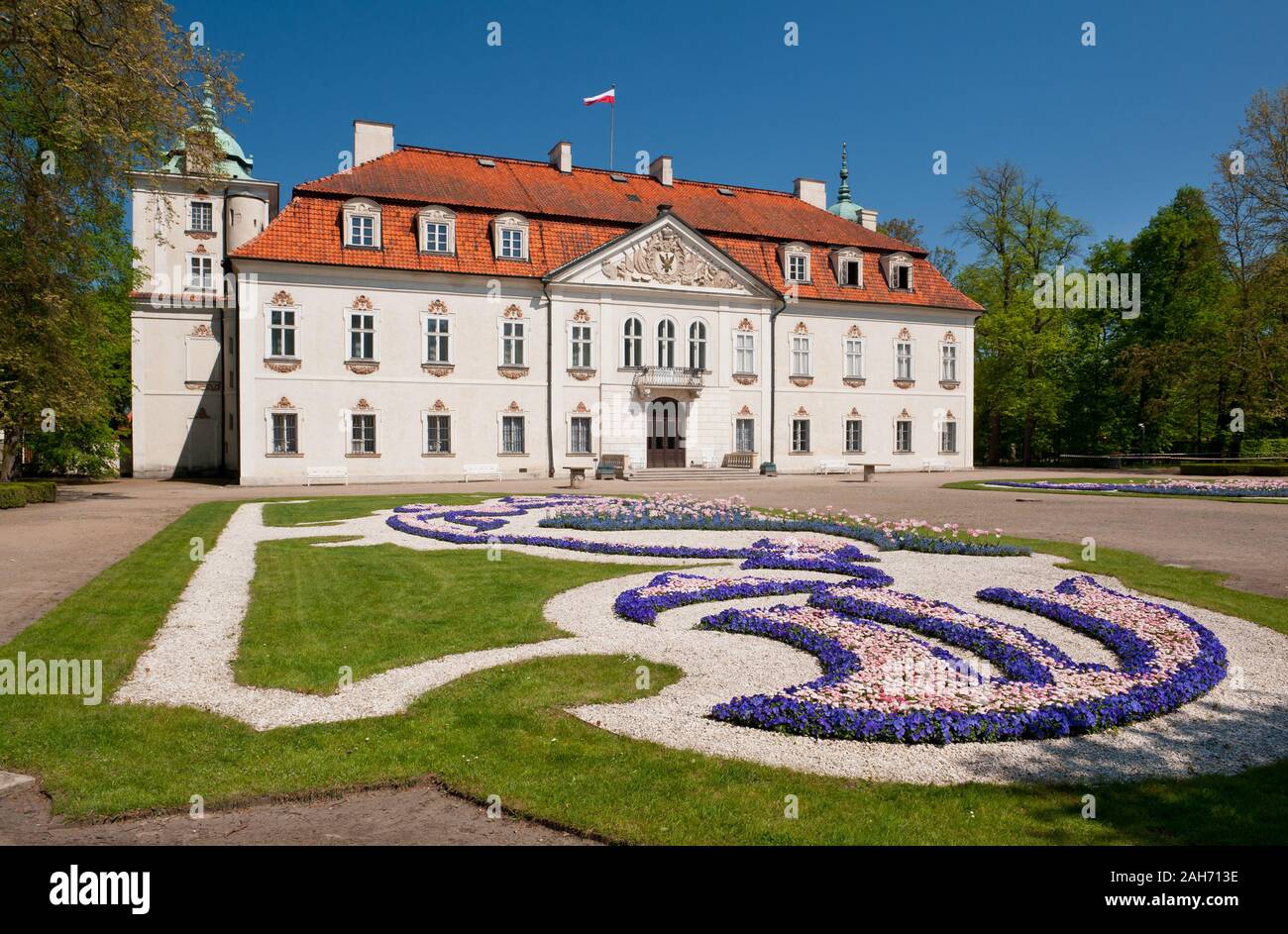 View at Radziwiłł's Palace in Nieborów exterior in Poland, Europe, building outside view across the ornamental baroque garden, visiting tourist places. Stock Photo