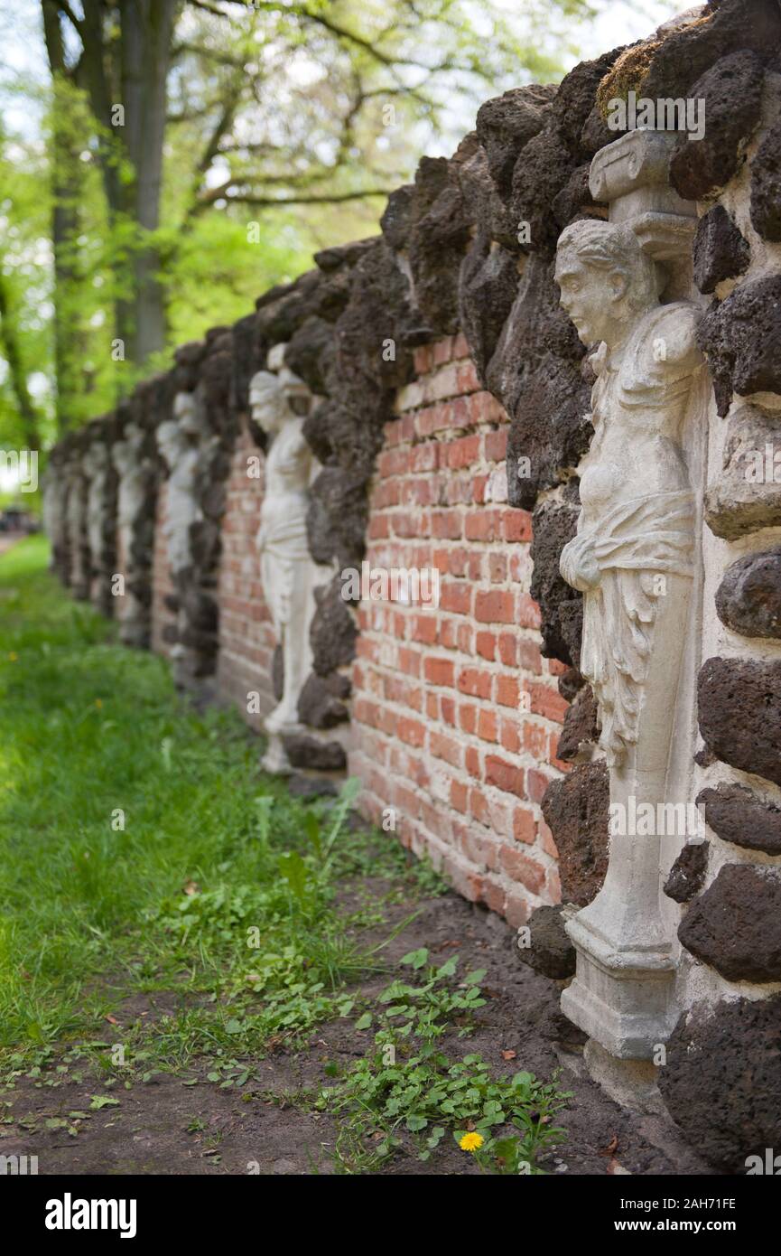Wall of herms along Przybytek Arcykapłana building, the High Priest Sanctuary in the Romantic Park in Arkadia, Poland, Europe, red bricks architecture Stock Photo