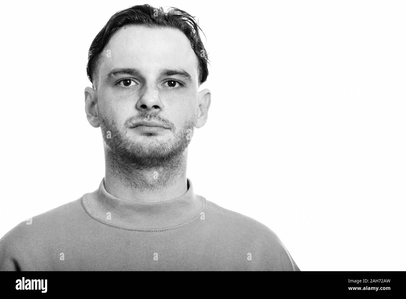 Studio shot of young man in black and white Stock Photo