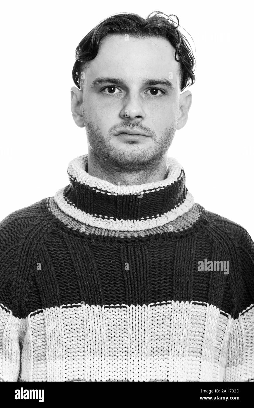 Face of young man wearing woolen sweater Stock Photo