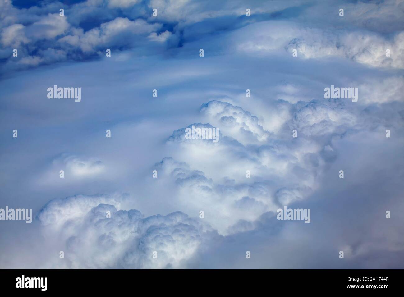 flying above fluffy white clouds Stock Photo - Alamy