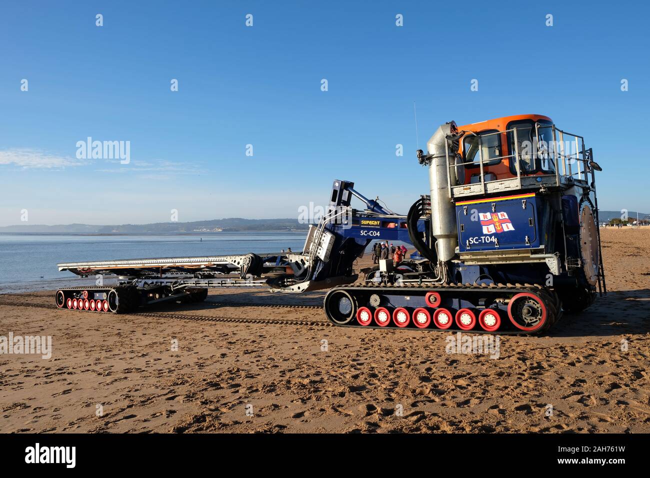 December 2019: The RNLI Supacat Tractor and Carriage waiting to haul Exmouth's Shannon-class lifeboat back to their lifeboat station at Exmouth beach Stock Photo