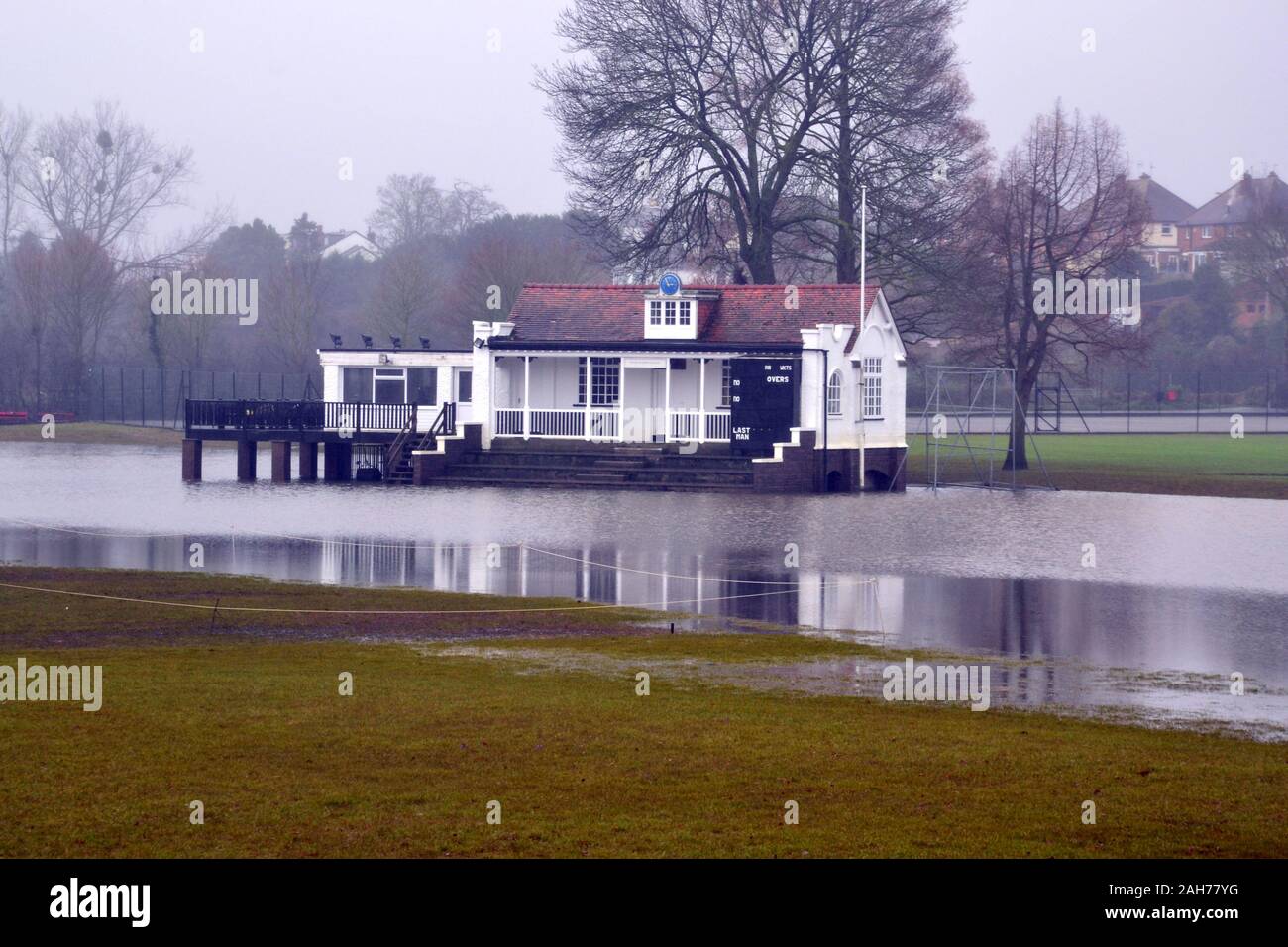 Worcestershire County Cricket Club Pavilion surrounded by flood water on Boxing Day, 2019. The Midlands and Southern England suffered floods during the approach to Christmas. UK media reported that leading politicians have called on Prime Minister Boris Johnson to overhaul the system for deciding where flood-defence funding is spent and launch an emergency response unit to prevent a repeat of the “catastrophic” damage caused by the November floods. Stock Photo