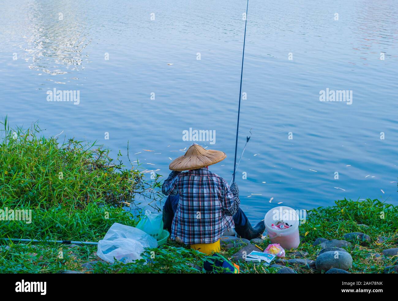 Taiwanese fisherman in Lotus lake in Kaohsiung Taiwan Stock Photo