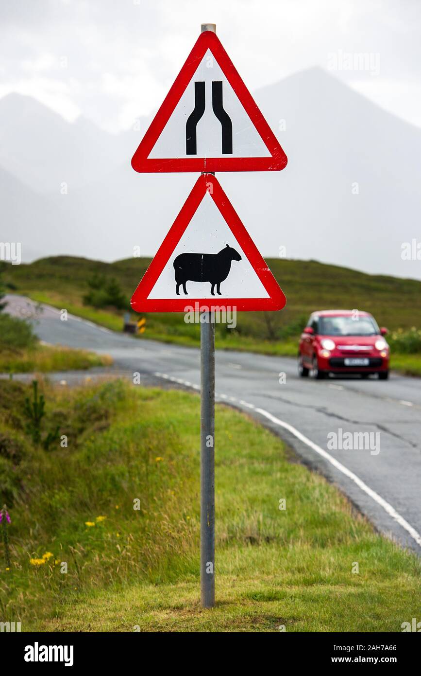 Close up of a scottish street sign with narrow road and sheep crossing warnings Stock Photo
