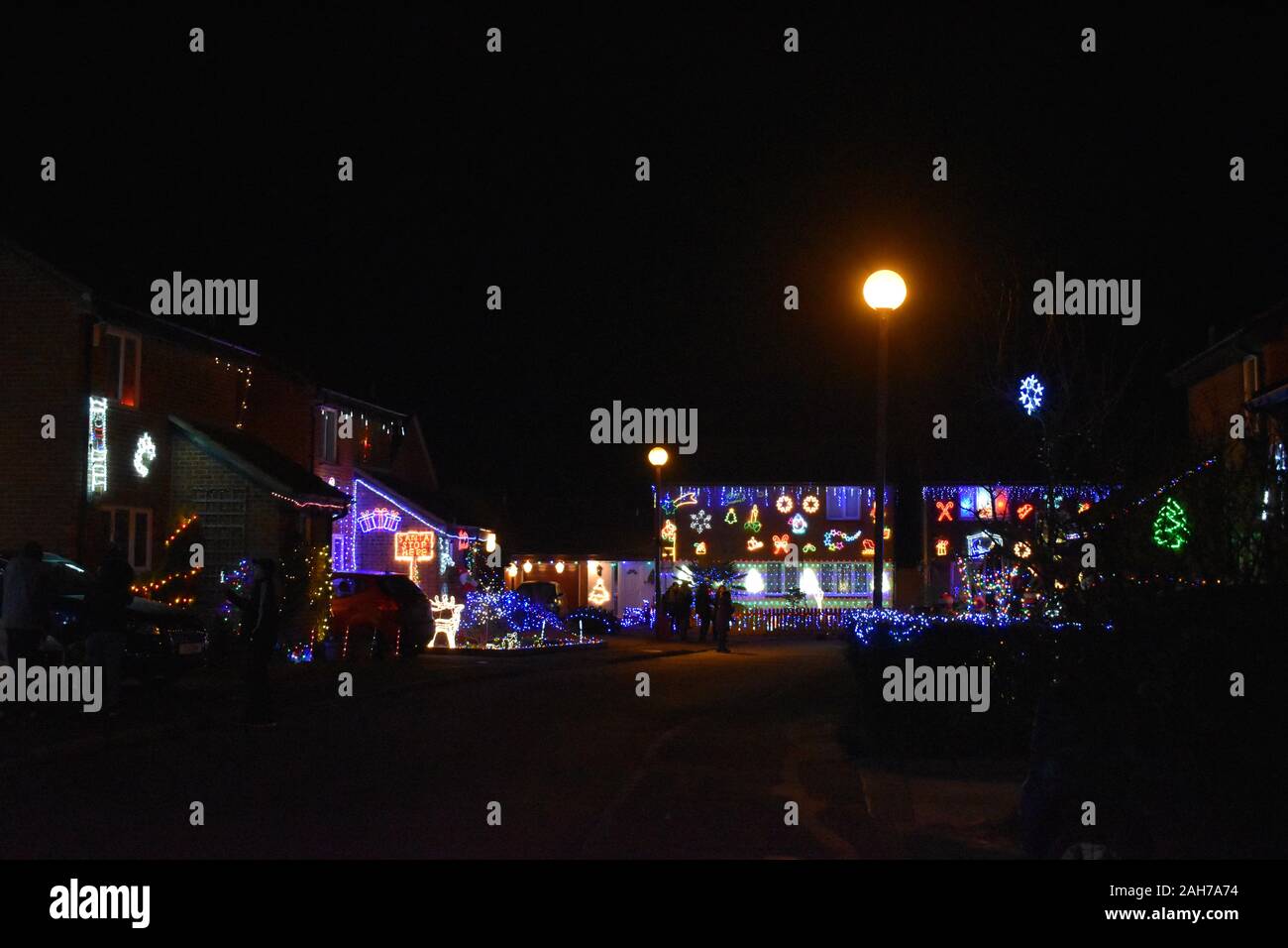 Christmas Street in Milton Keynes - a cul-de-sac of houses, all decorated for Christmas to raise money for Willen Hospice. Stock Photo