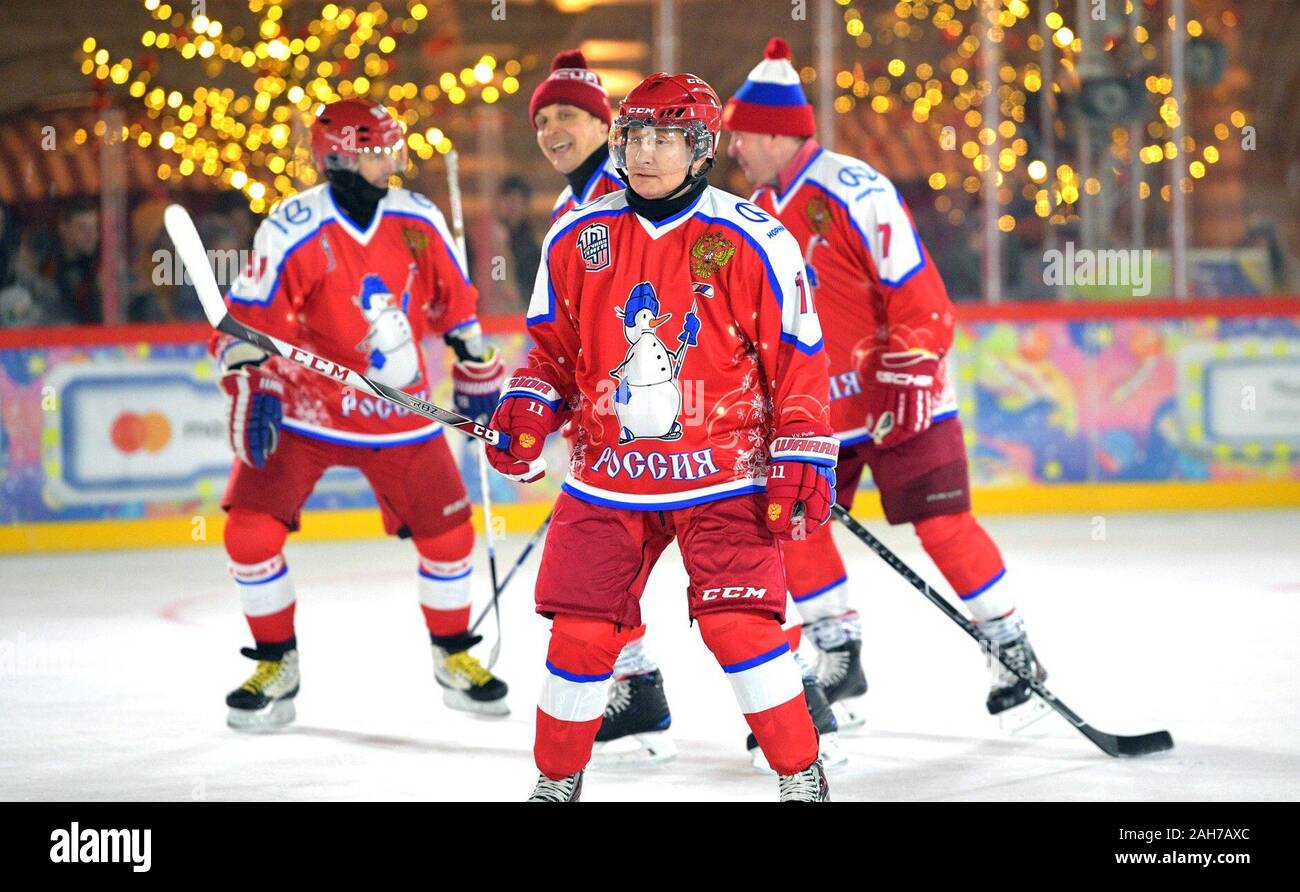 December 25, 2019. - Russia, Moscow. - Russian President Vladimir Putin takes part in a Night Hockey League friendly match at the GUM ice rink on Red Square. Stock Photo