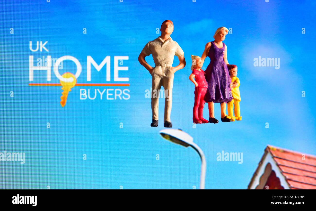 UK home buyers web page with miniature figurine family Stock Photo