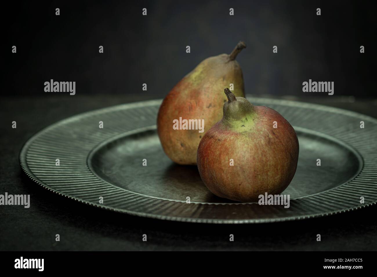 Two pears on a vintage silver platter Stock Photo