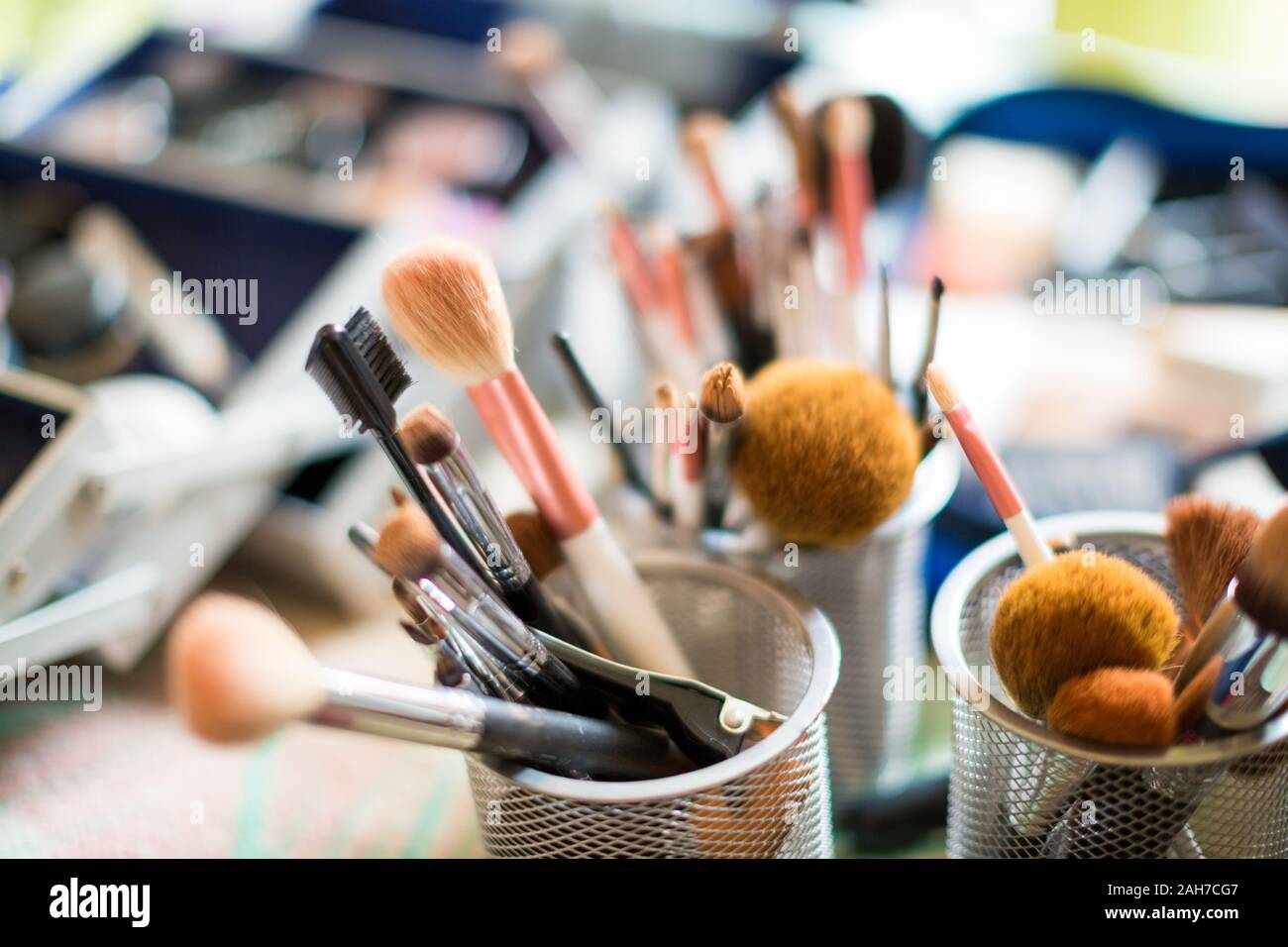 Close up of a set of make up brushes against a bokeh background Stock Photo