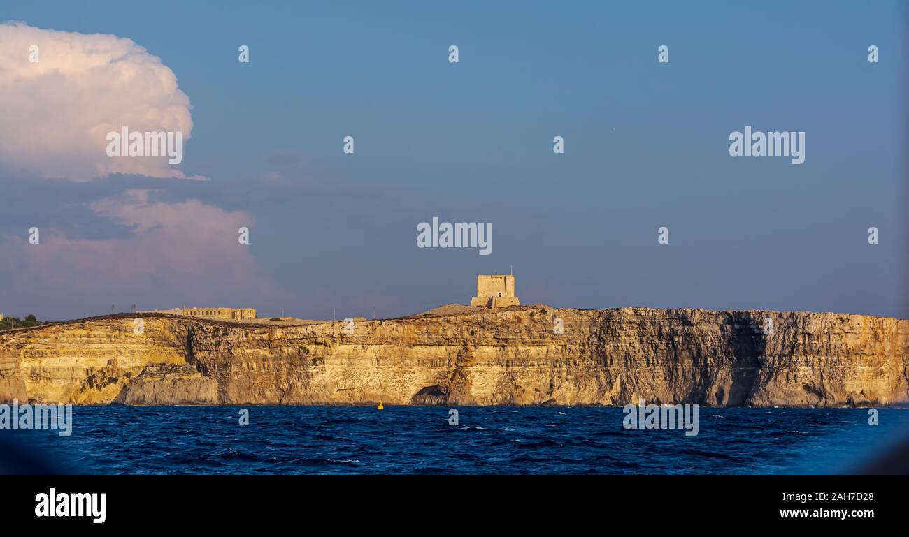 Saint Mary's Tower, or Comino Tower, shot from the water Stock Photo