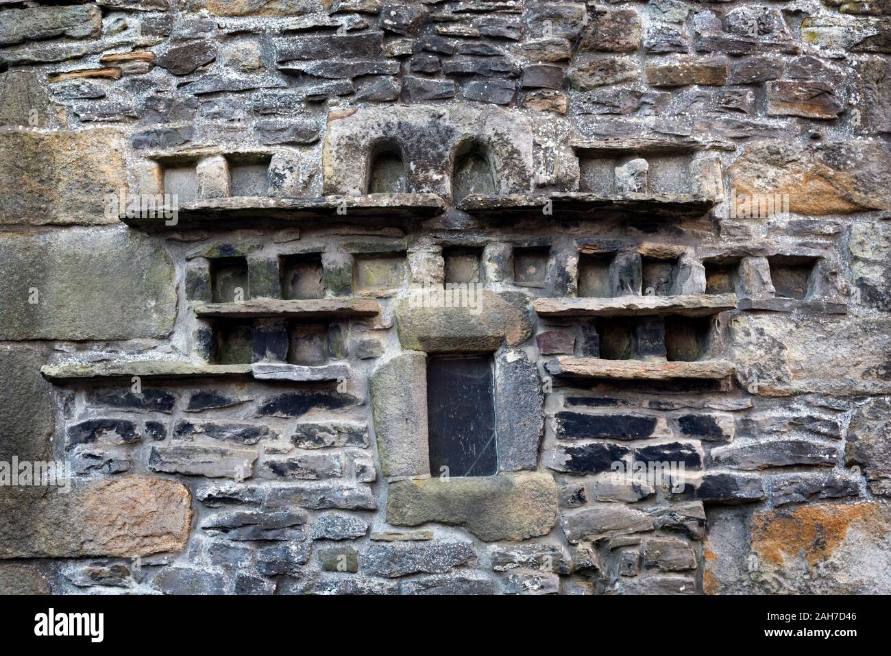 Pigeon holes in wall of Pletts Barn, a listed building in the town of Grassington, Yorkshire Dales National Park, UK Stock Photo