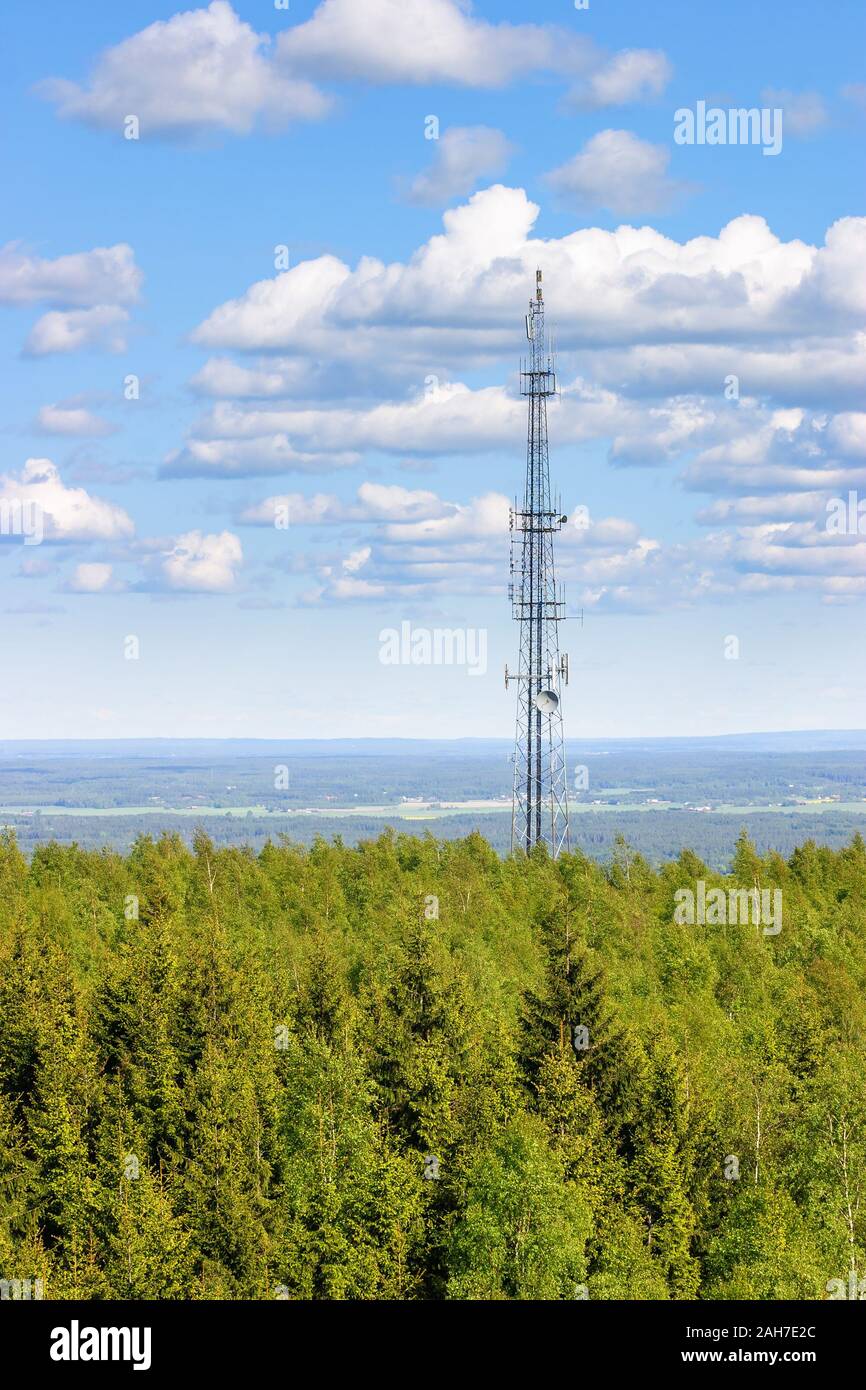 Communication mast in a forest and with aerial view of the landscape Stock  Photo - Alamy
