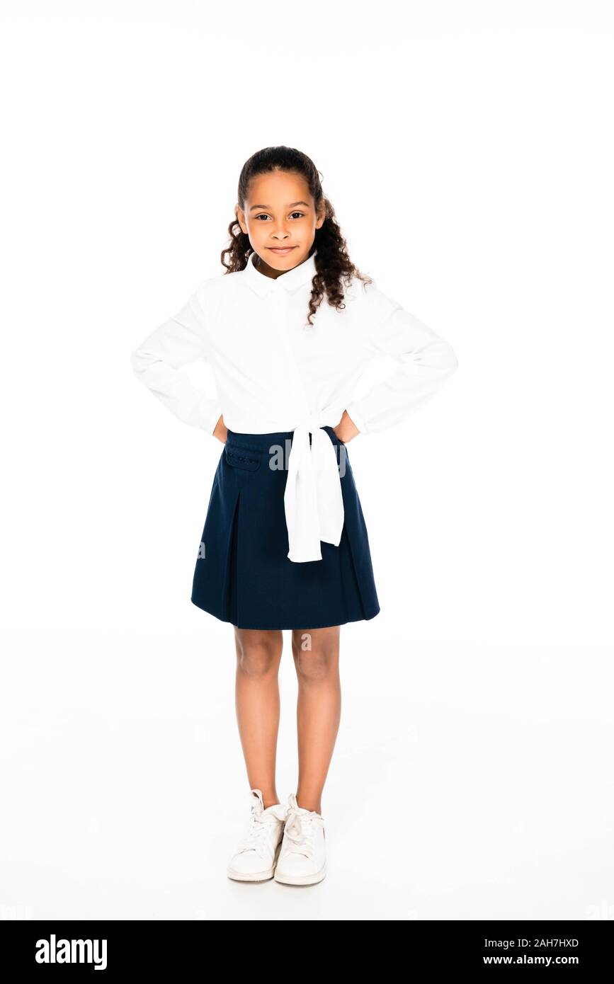 full length view of smiling african american girl posing at camera on ...