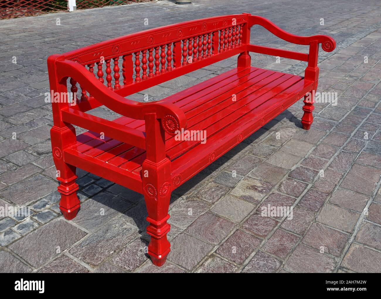 Red wooden bench outdoors in Doha, Qatar Stock Photo - Alamy