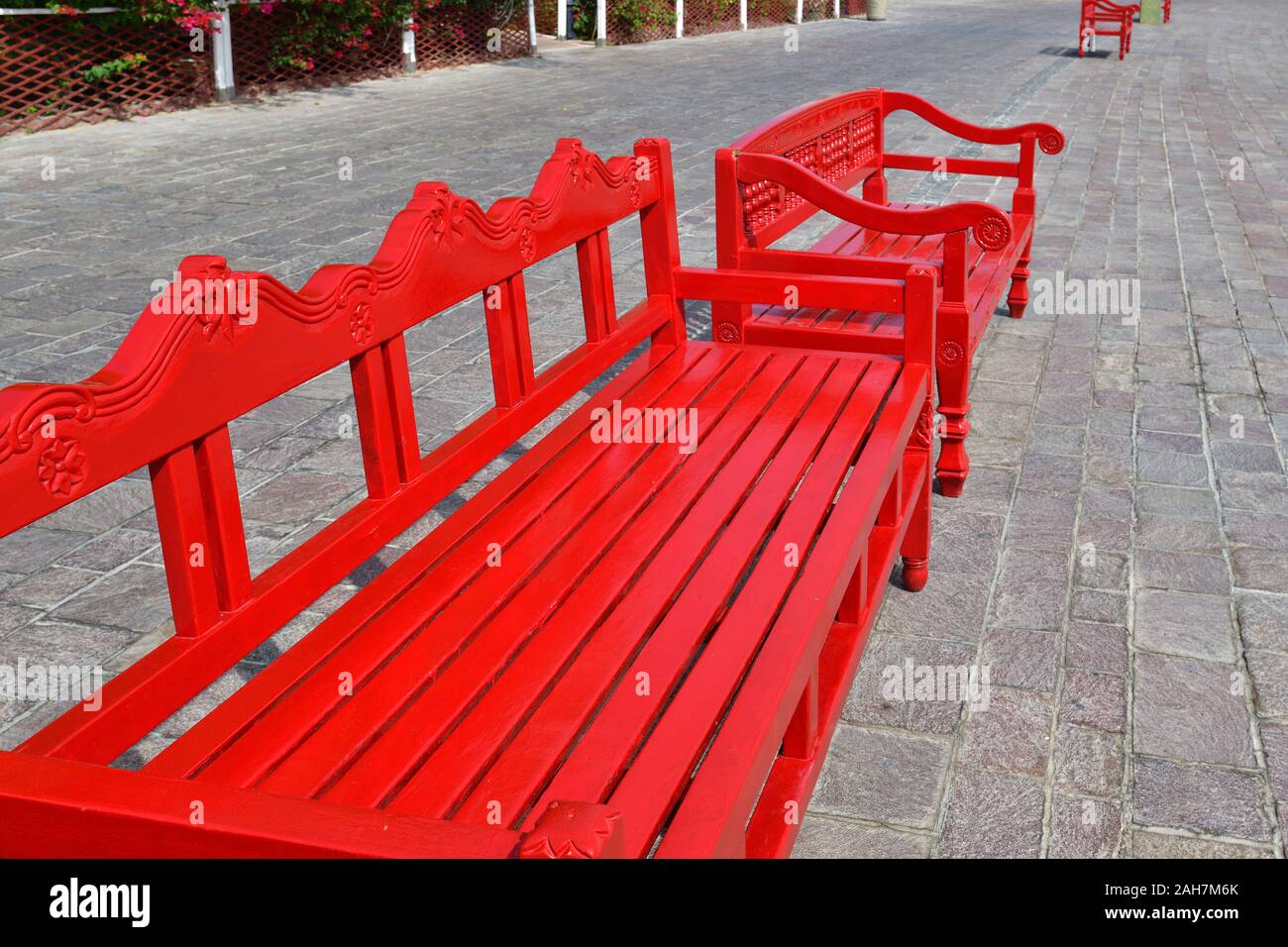 Red wooden bench outdoors in Doha, Qatar Stock Photo Alamy