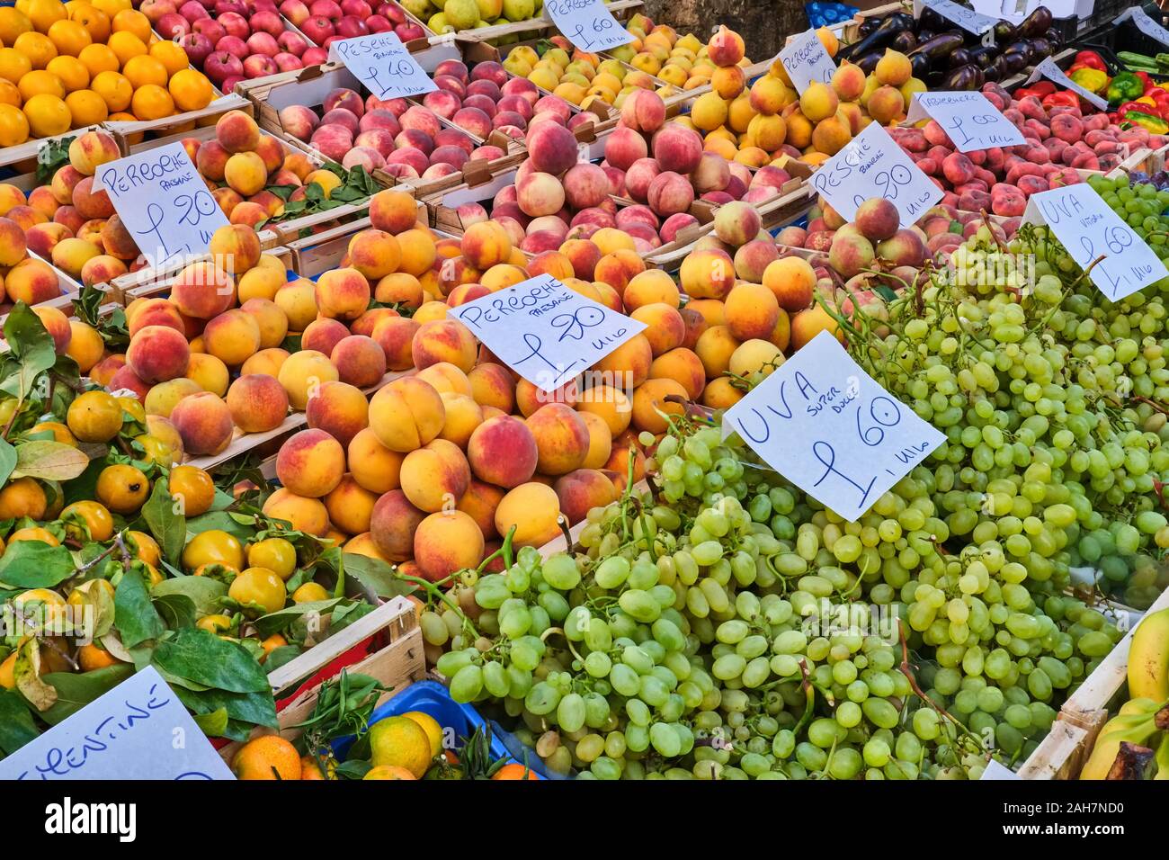 Peaches, grapes and other fruits for sale at market Stock Photo Alamy