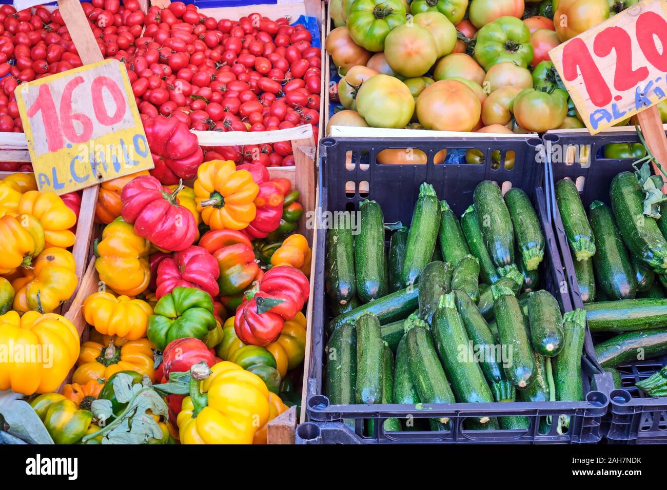 Zucchini, bell pepper and tomatoes for sale at a market Stock Photo