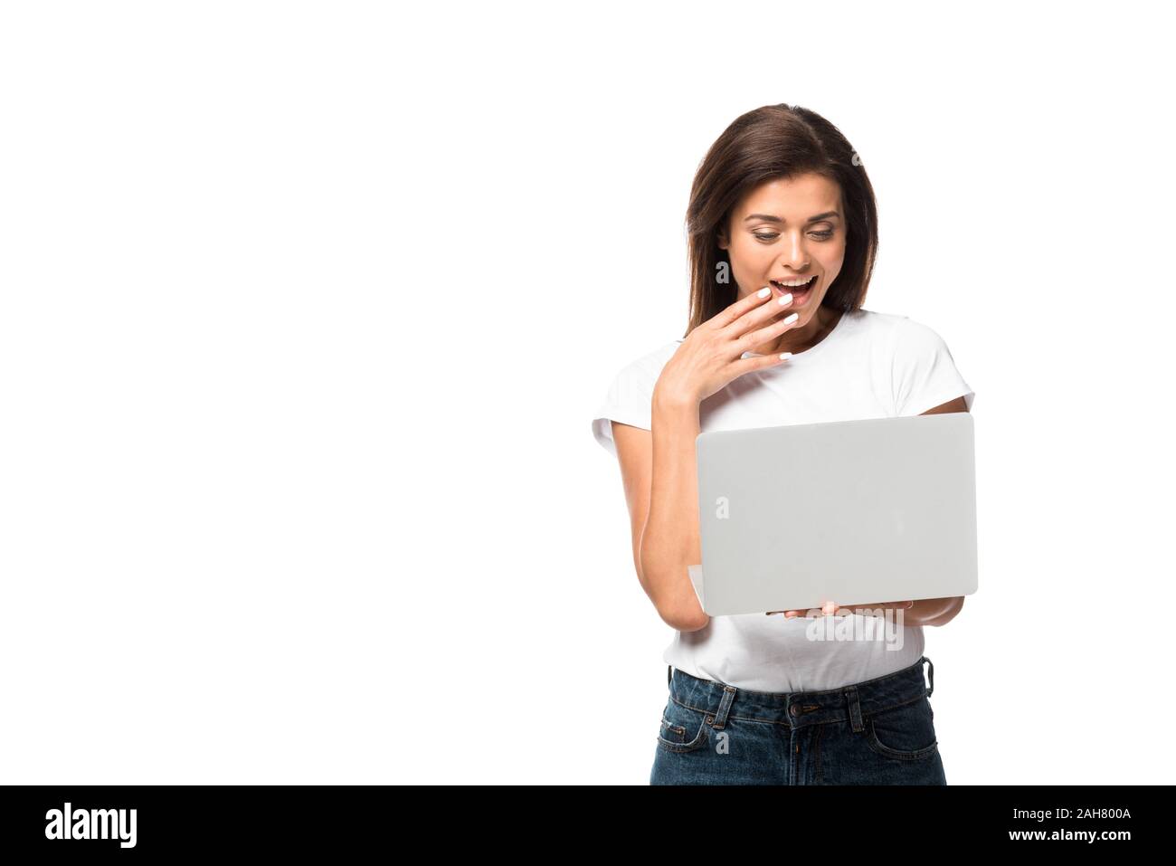 beautiful shocked woman using laptop, isolated on white Stock Photo