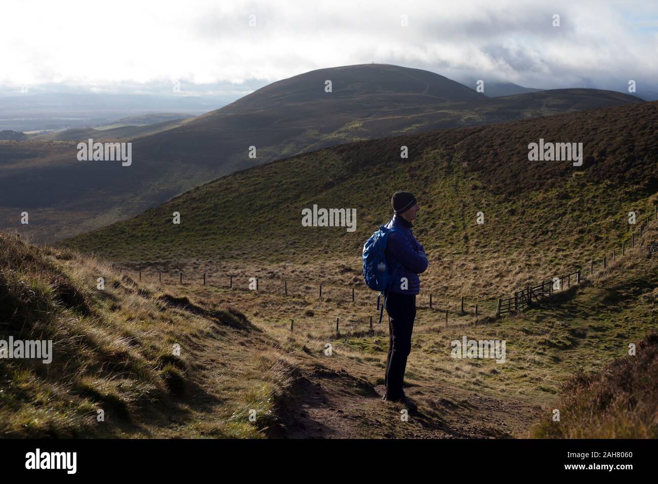 Man Walking on the Pentland Hills in Scotland. Pako Mera Stock Photo